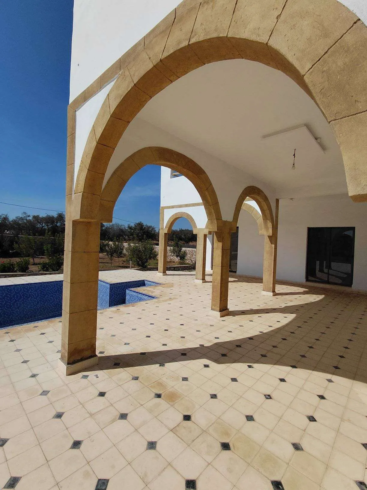 Villa exterior showing peaceful surroundings and garden