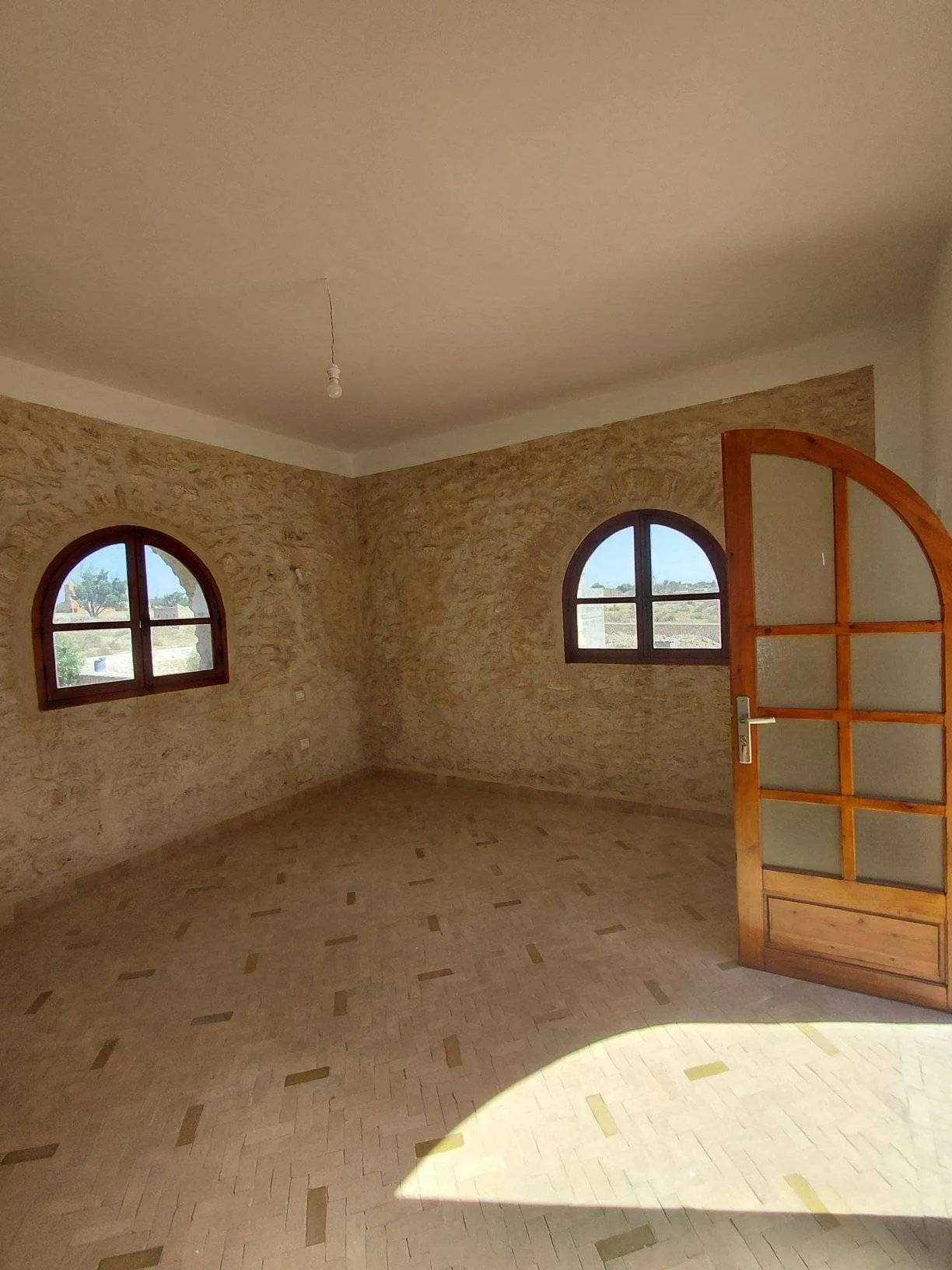 Villa pool area surrounded by greenery