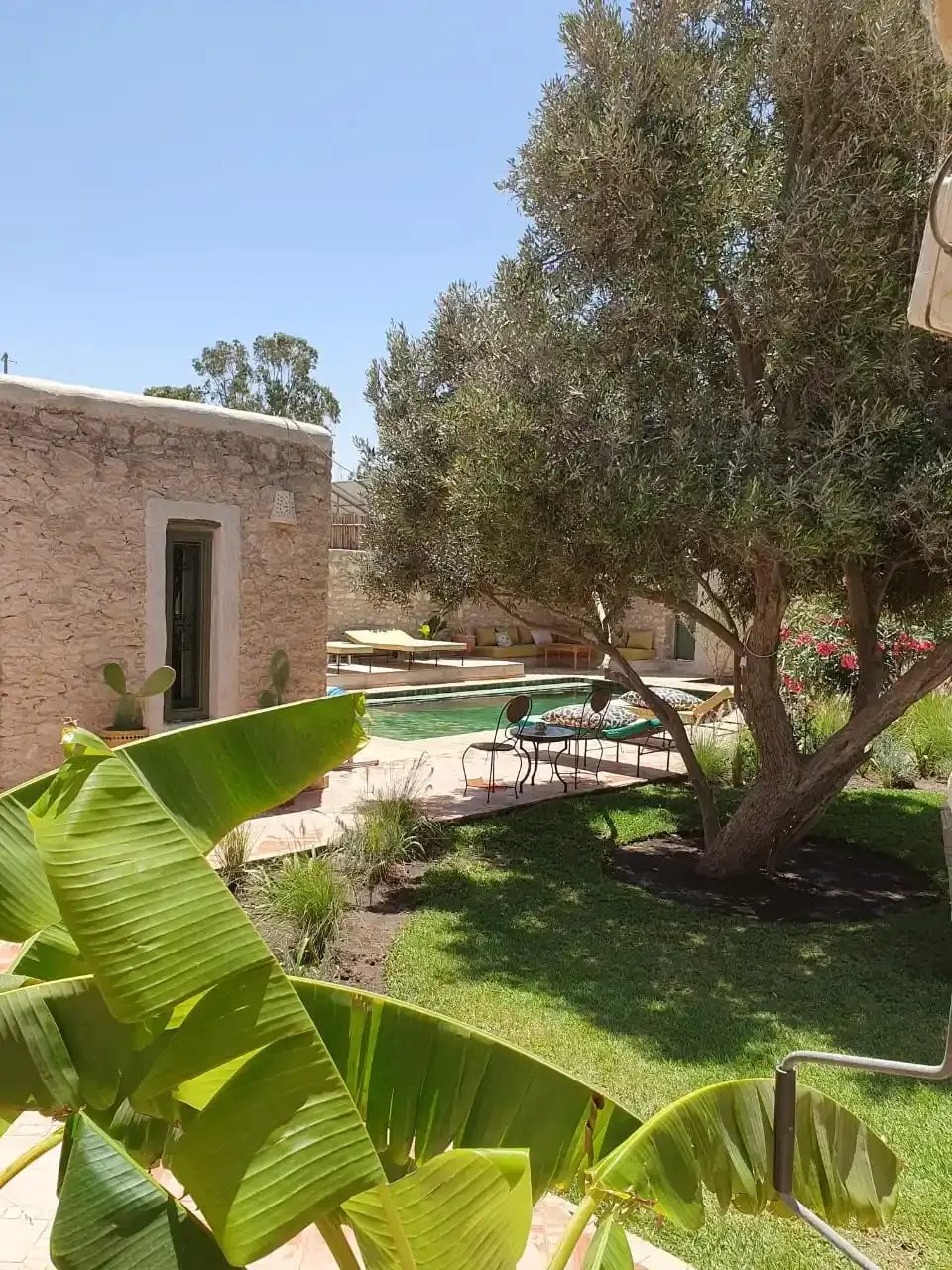 Enclosed villa property with garden and olive tree