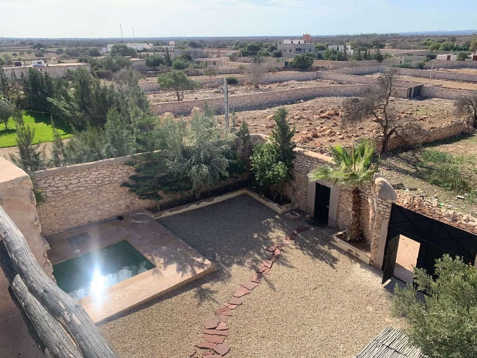 Entrance of the villa with surrounding peaceful environment