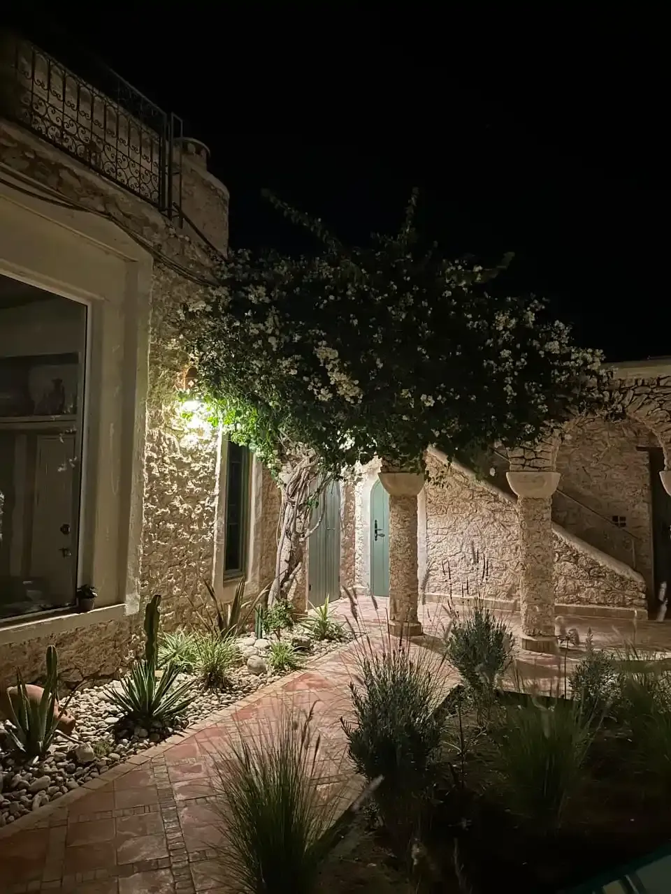 Villa entrance with paved road access