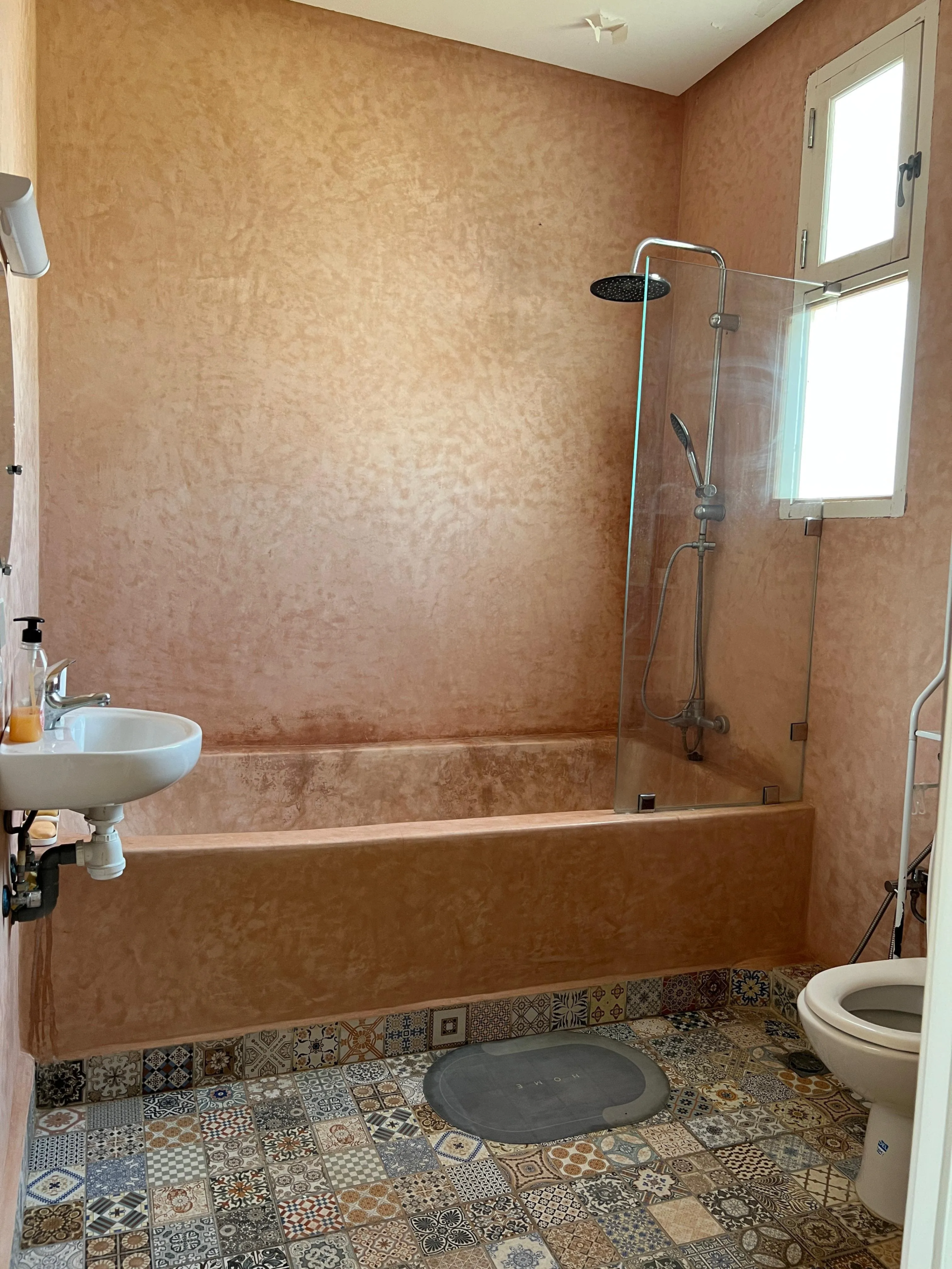 Bedroom with private bathroom and natural light