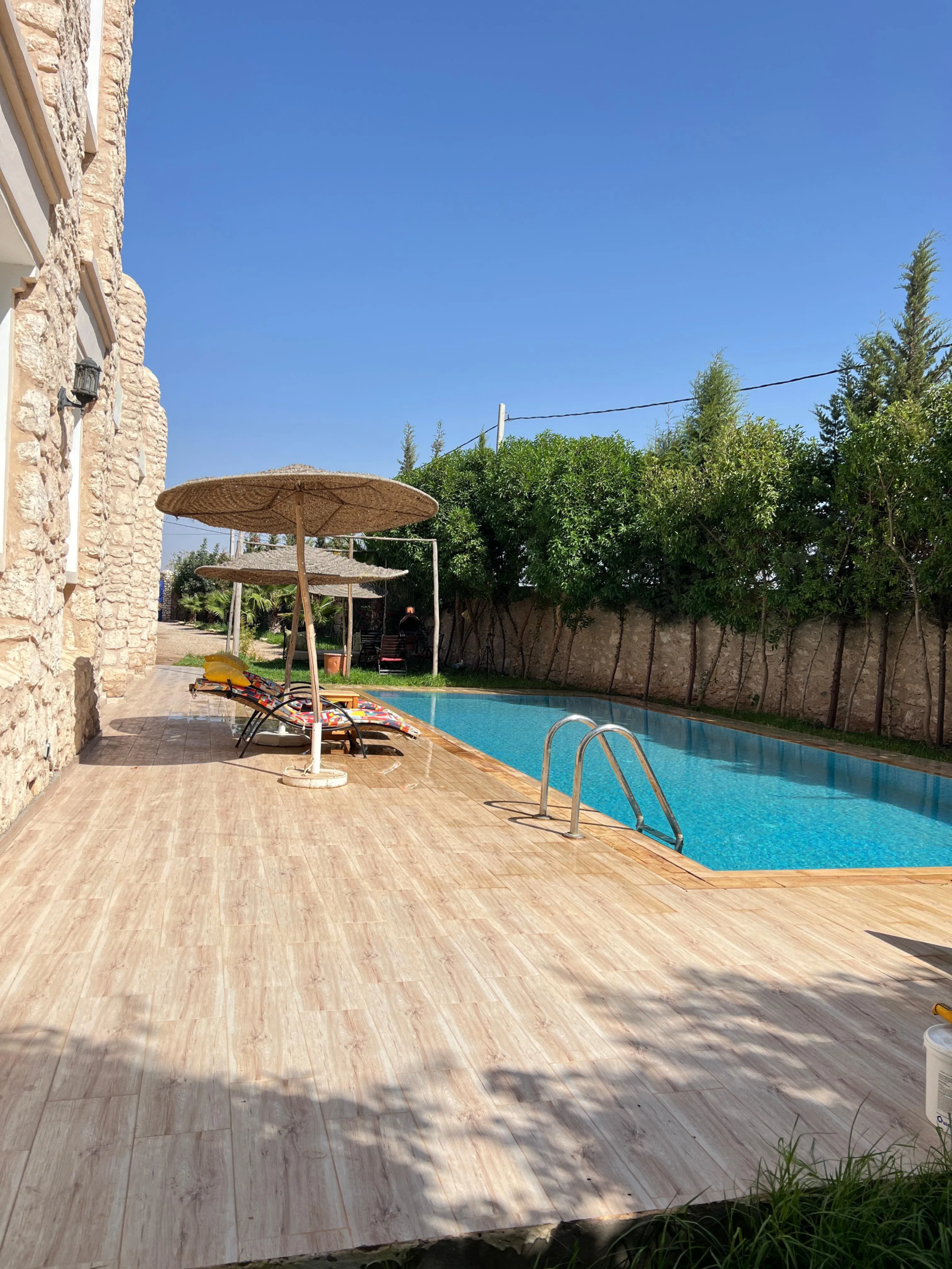 Exterior view of furnished villa surrounded by peaceful landscape