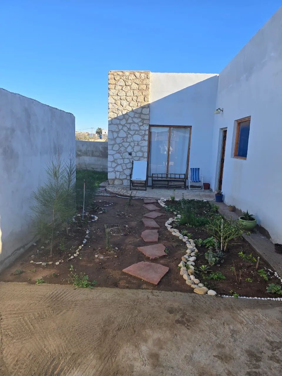 Fully equipped living space opening toward outdoor areas