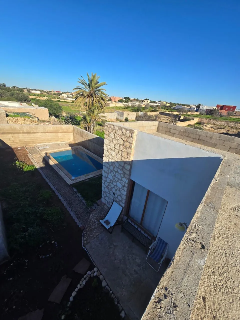 Living area with natural light and semi-furnished interior