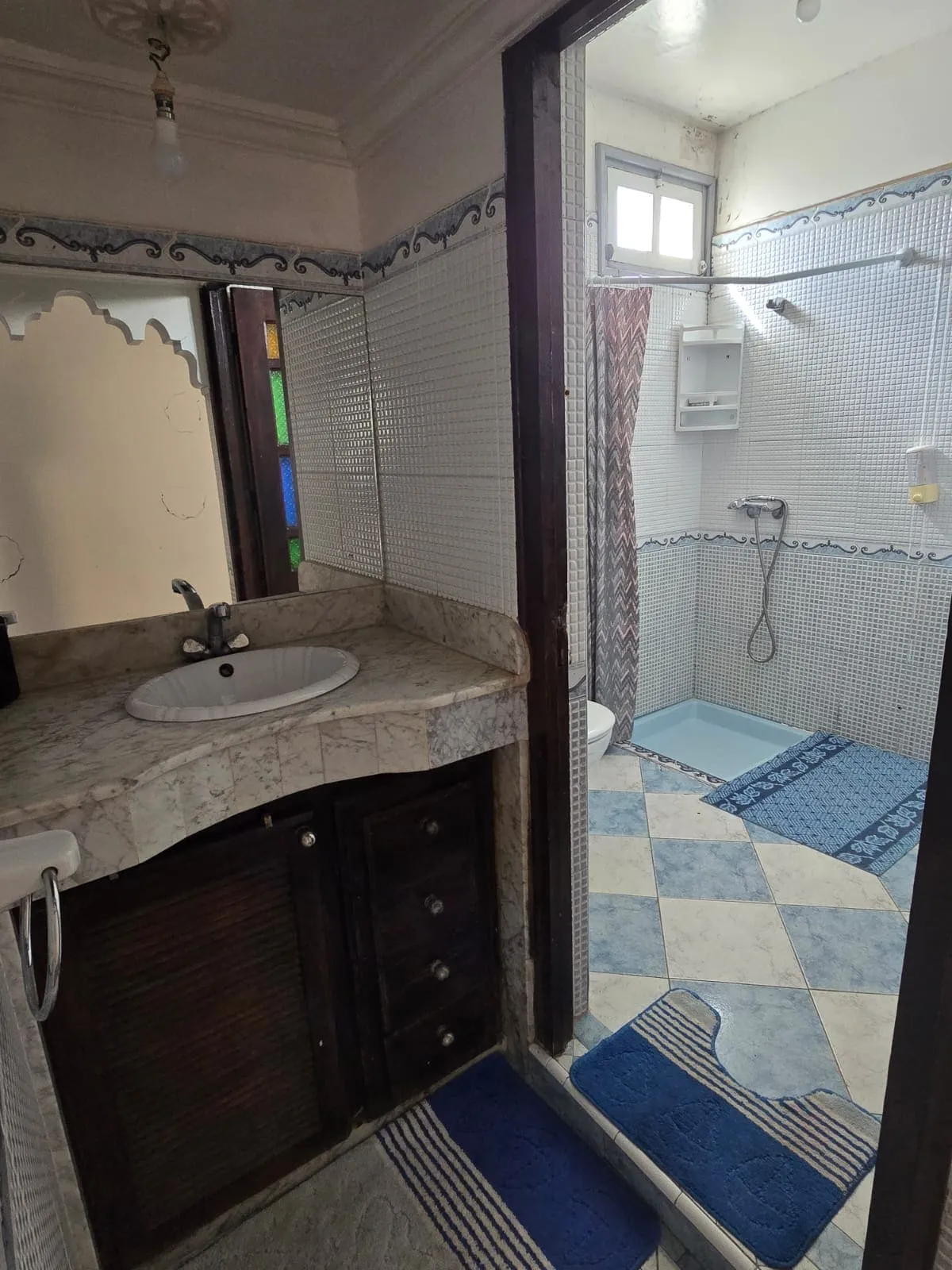 Bathroom with shower in furnished apartment in Essaouira