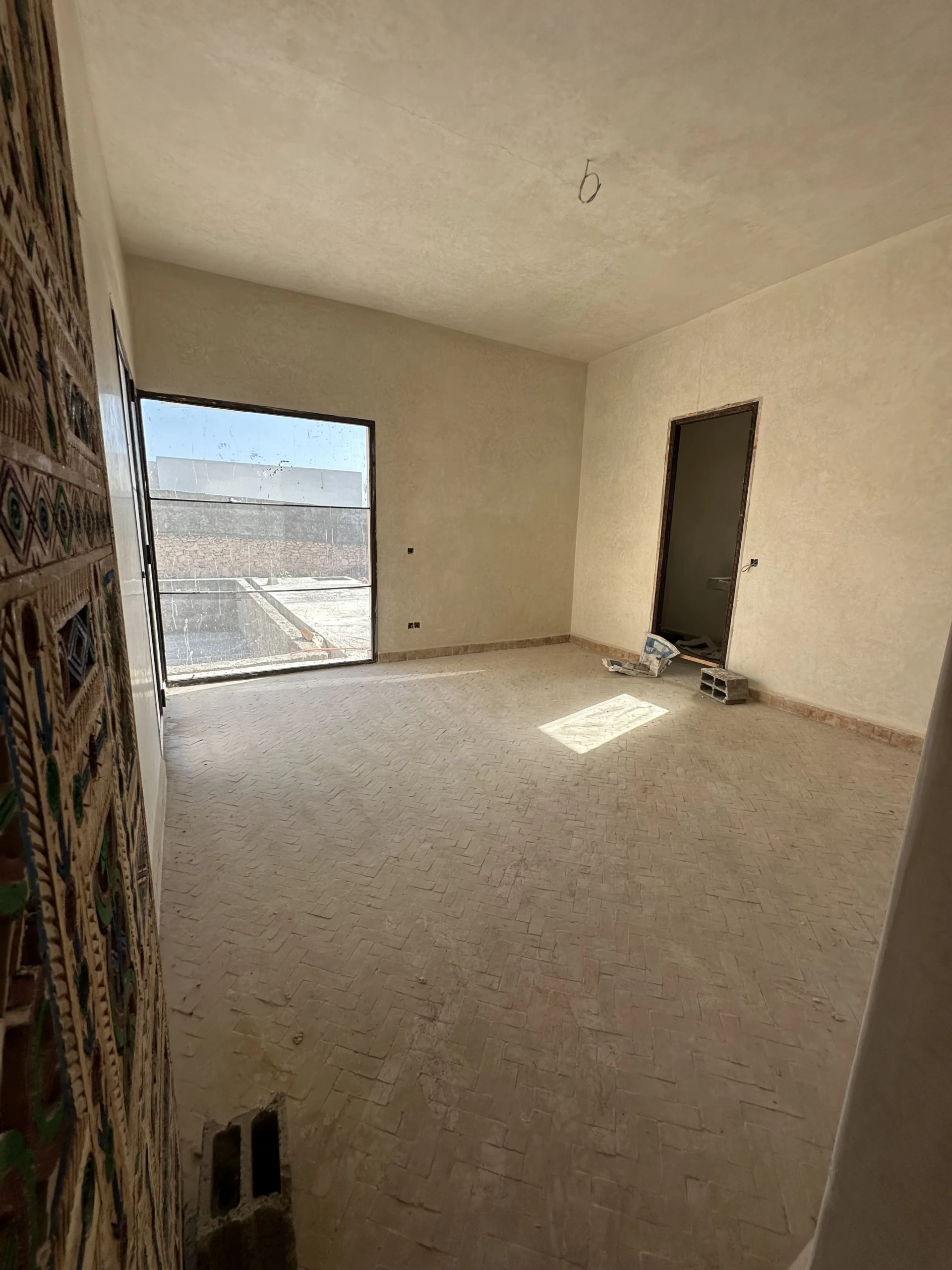 Bedroom with direct access to the swimming pool in a villa in Ghazoua