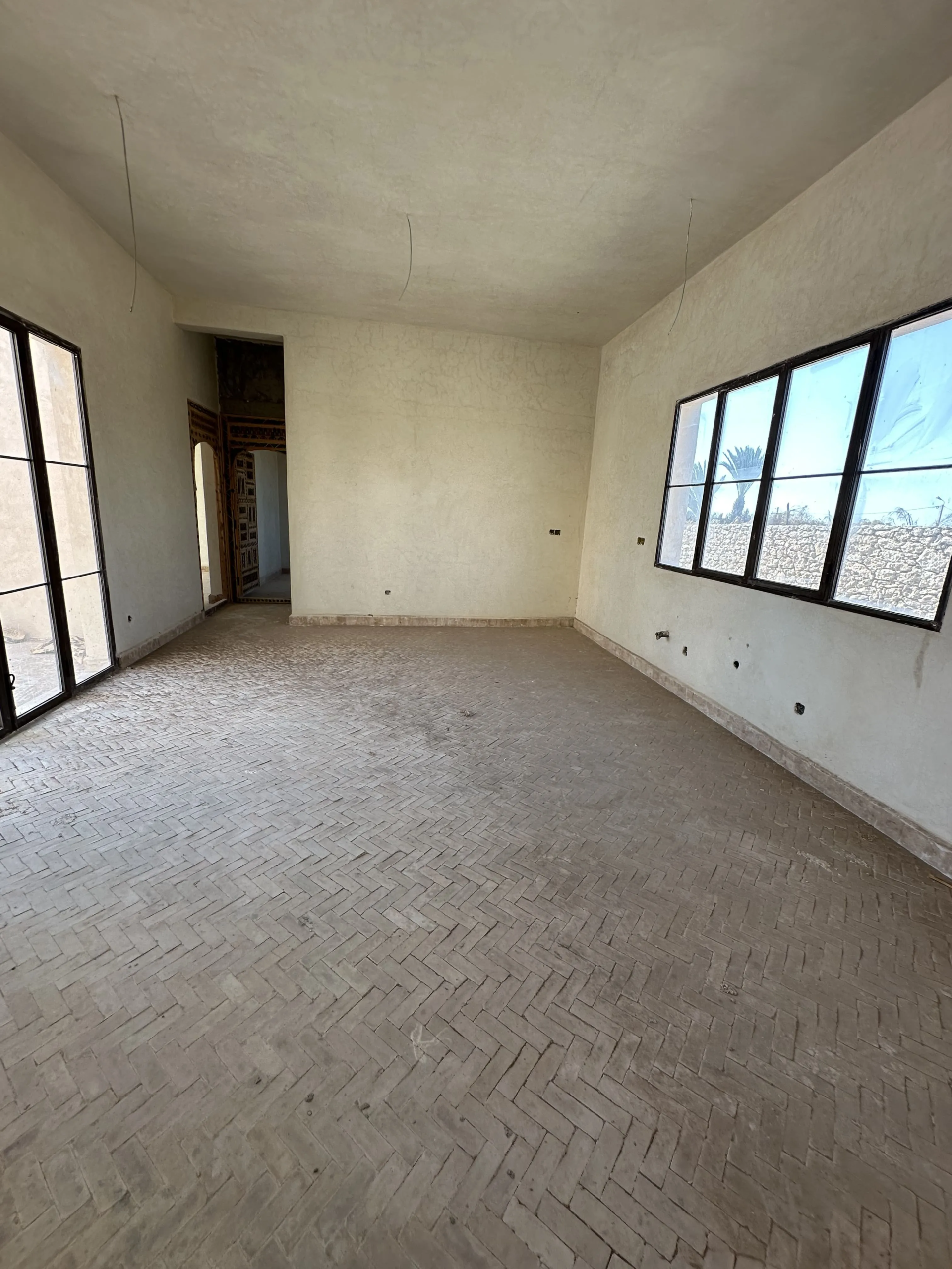 Bright kitchen with direct access to the villa swimming pool