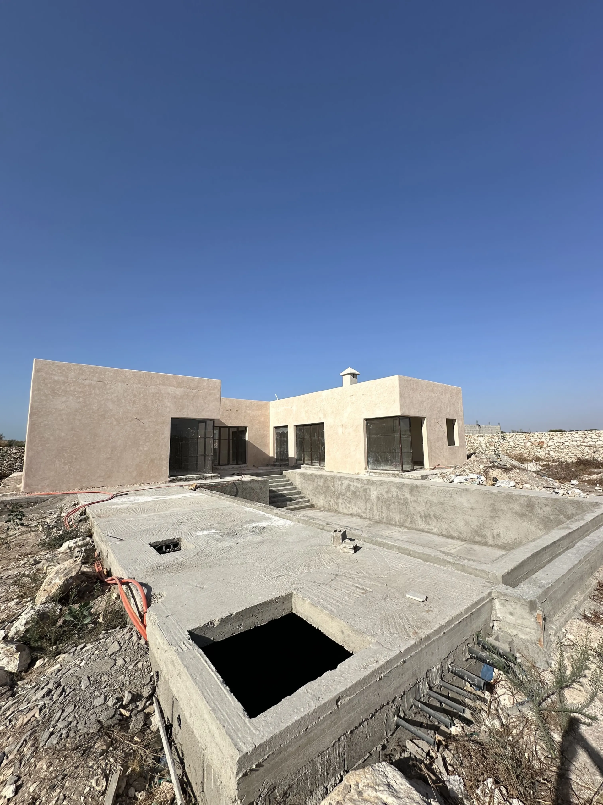 Private swimming pool surrounded by the garden of this villa in Ghazoua Essaouira