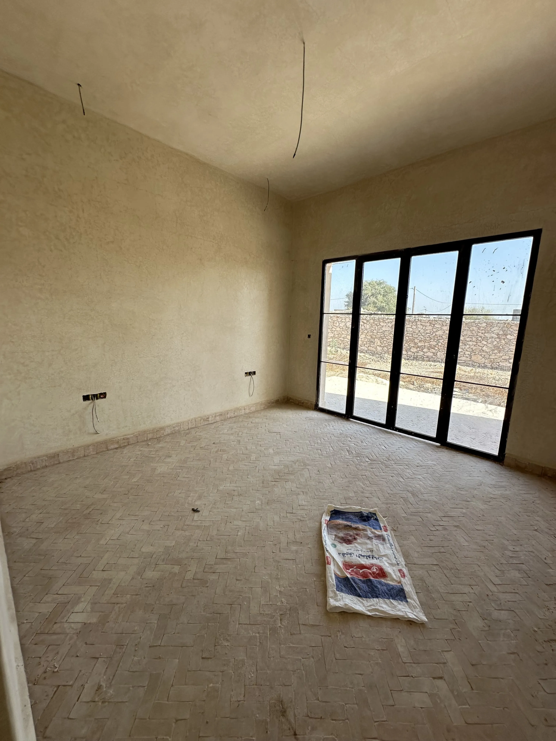 Spacious bedroom overlooking the outdoor areas of the villa
