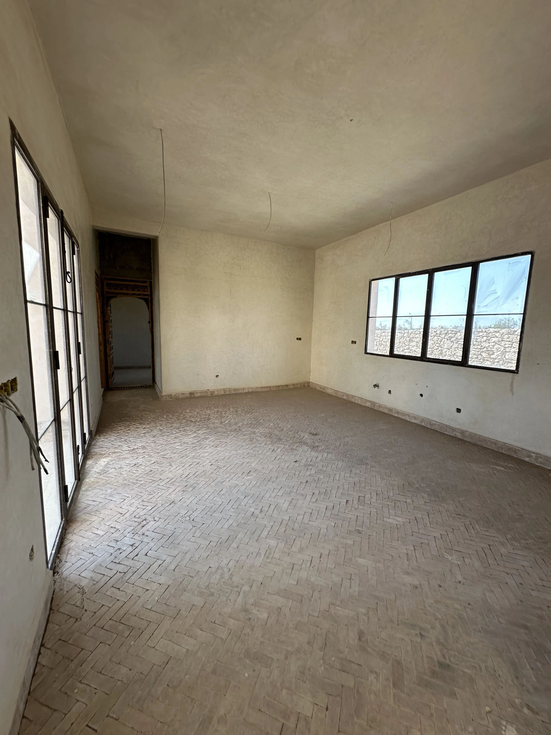 Villa kitchen opening onto the pool area in Ghazoua
