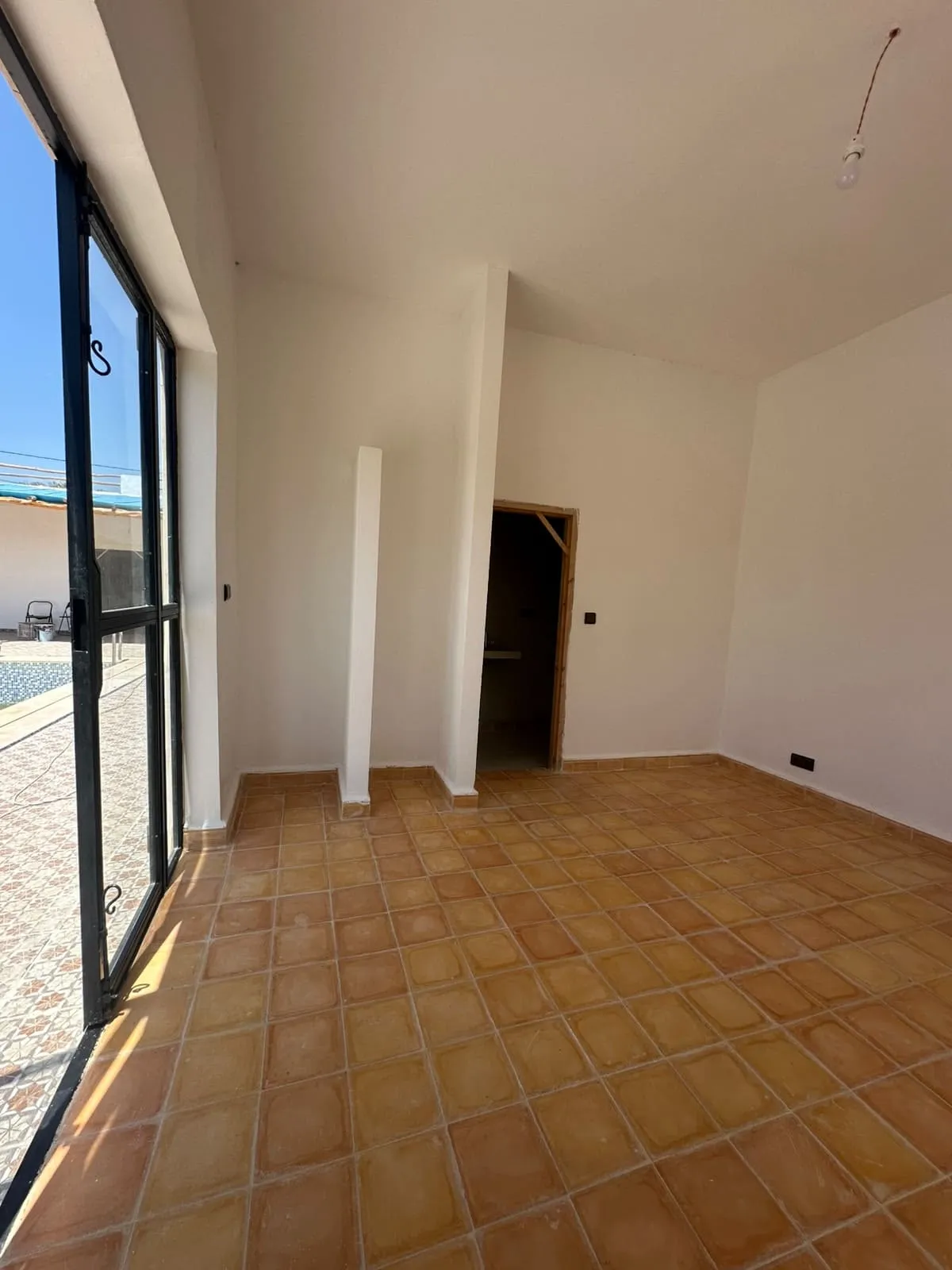Bright bedroom opening onto the garden
