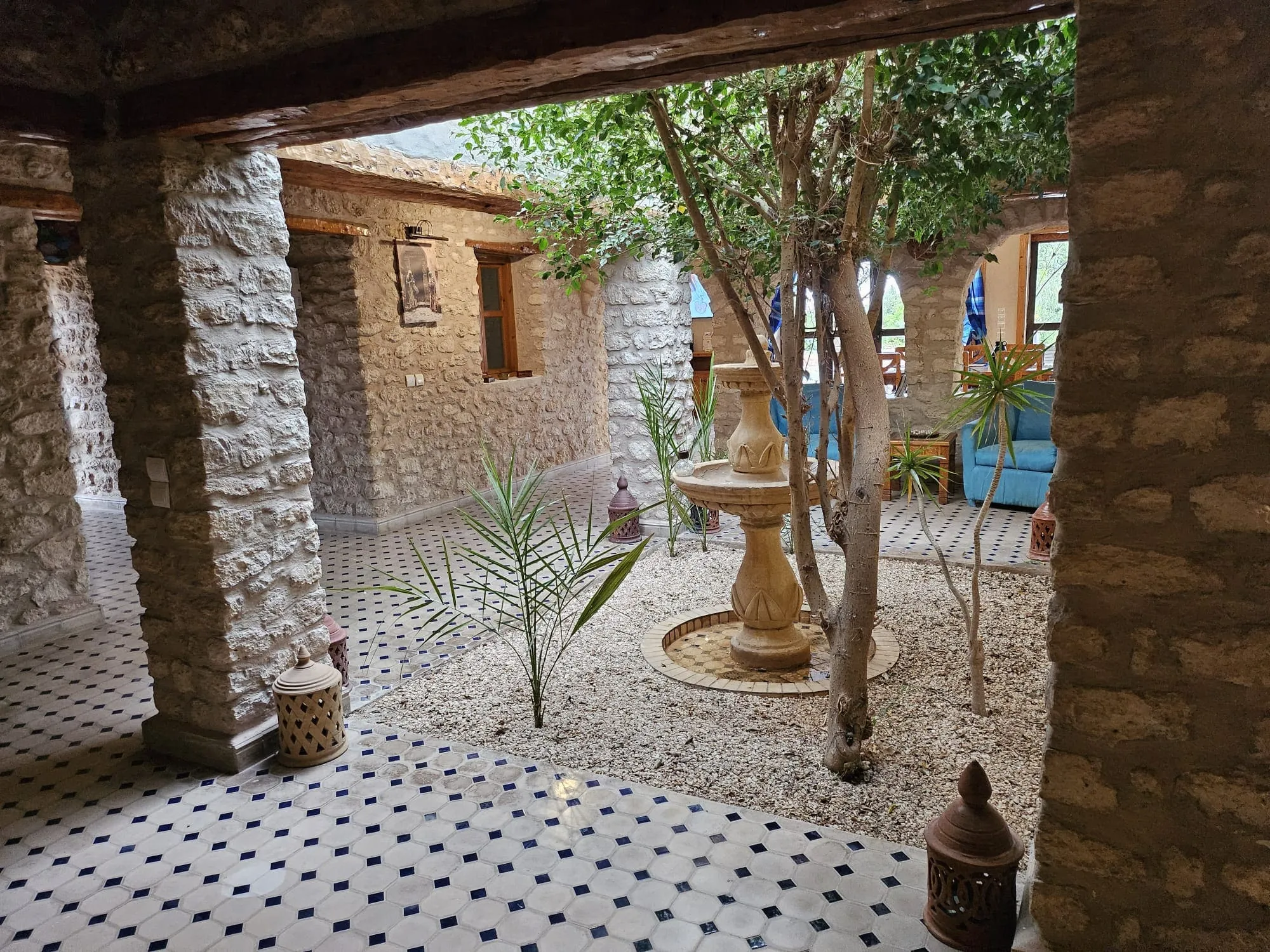 Central patio with tree and traditional stone architecture