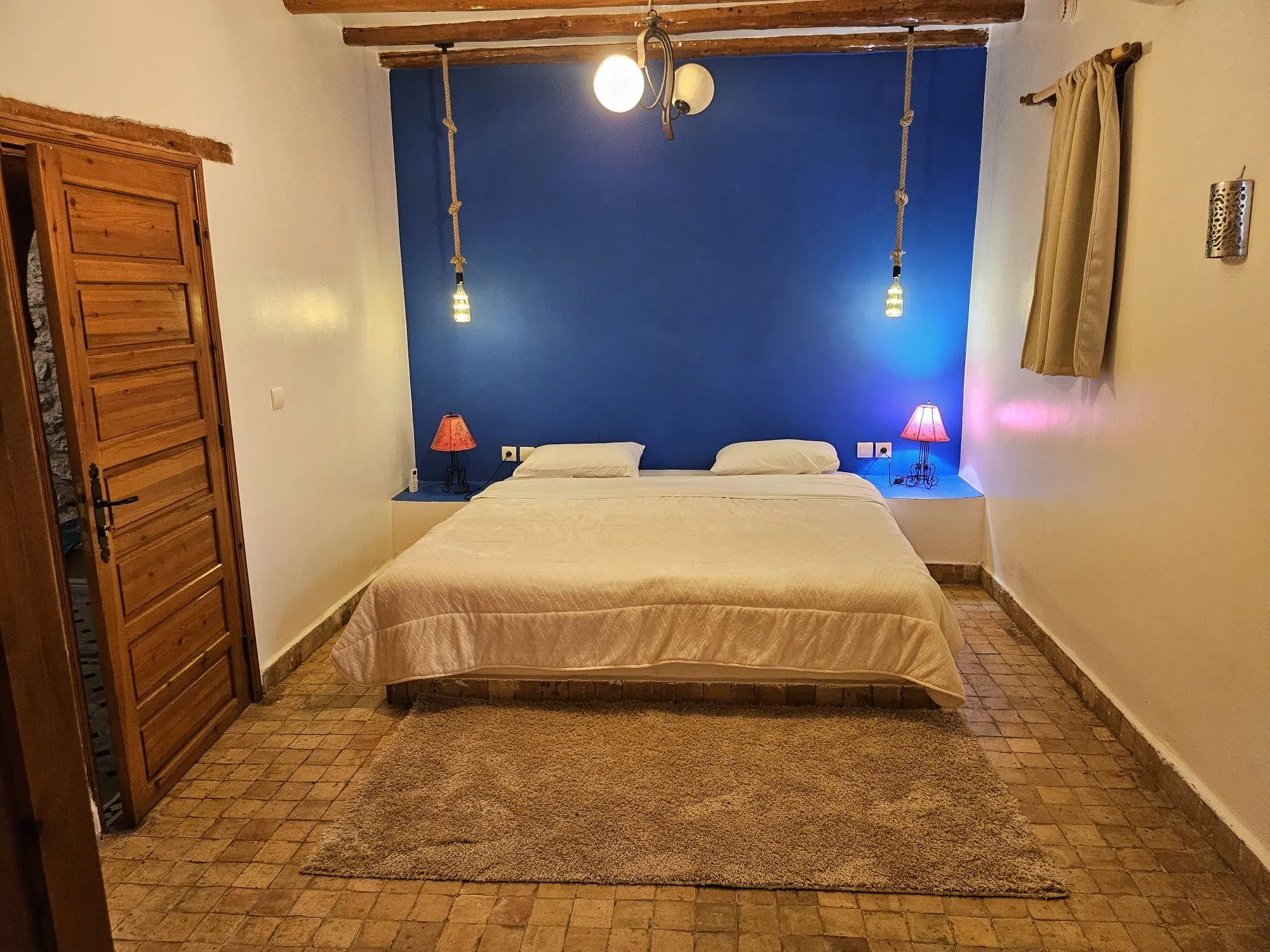 Comfortable bedroom suite with handcrafted decor near Essaouira
