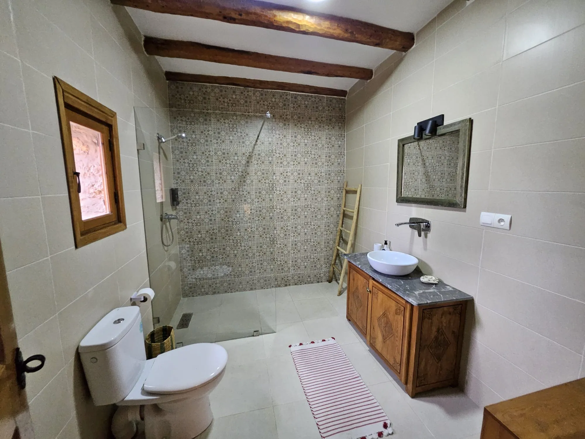 Comfortable private bathroom with traditional design details
