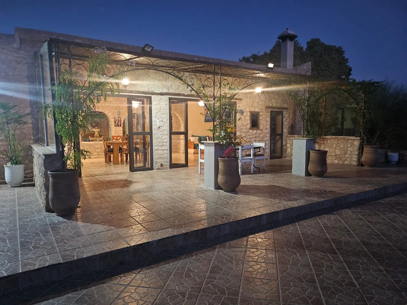 Exterior facade of stone villa surrounded by nature near Essaouira