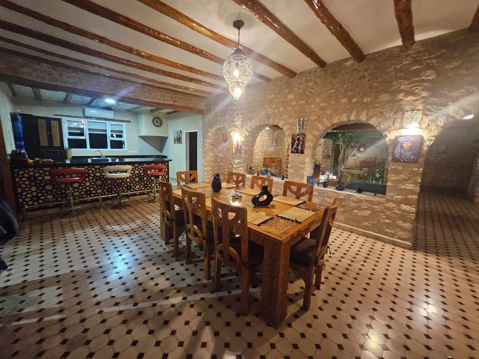 Open-plan dining area and kitchen in stone villa near Sidi Kaouki
